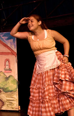 A A young acress performs in a play at Tripp Lake's Theatre.